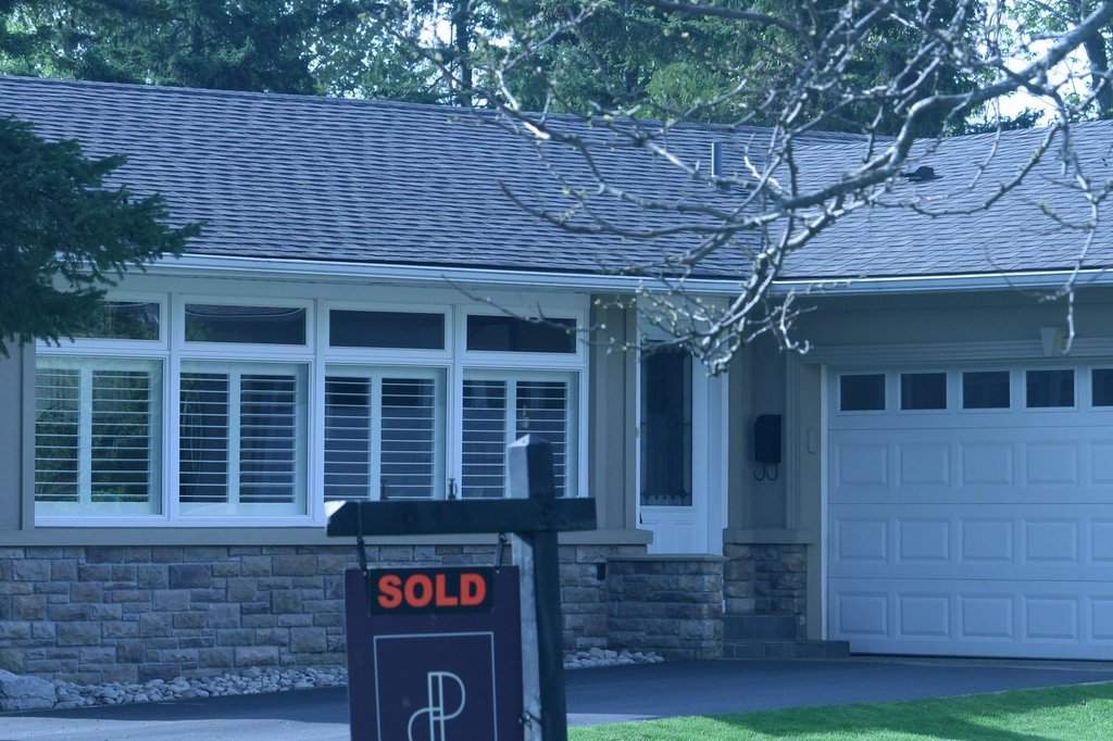 Greater Toronto Area-home sales ticked 2.4 per cent lower in June compared with a year earlier as 6,243 properties changed hands, while new listings rose. Real estate signage is shown in Oakville, Ont., west of Toronto on Saturday, May 11, 2024. THE CANADIAN PRESS/Richard Buchan.