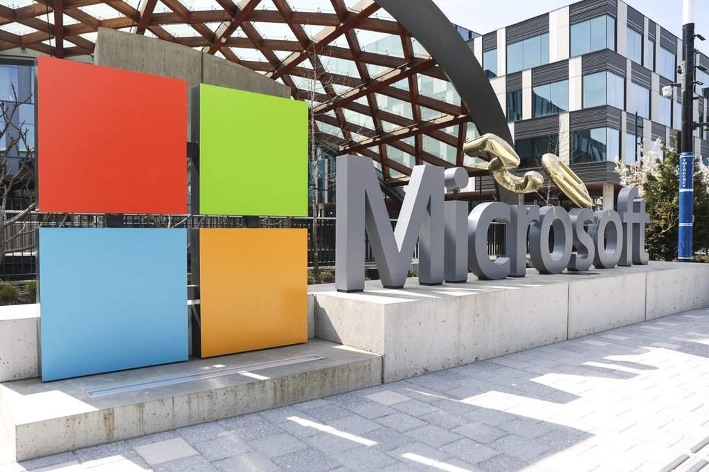 FILE - A Microsoft sign and logo are pictured at the company's headquarters, Friday, April 4, 2025, in Redmond, Wash. 