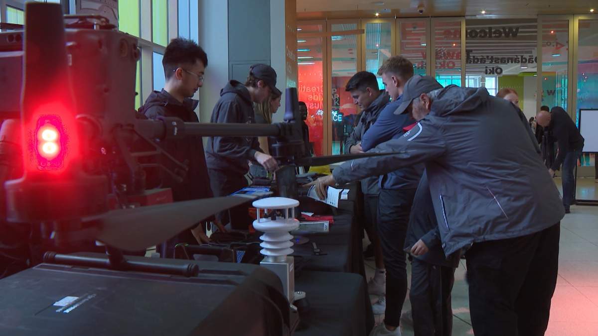 Researchers with the Northern Hail Project explain the science of hailstorm to interested members of the public during an information session at the Calgary Science Centre on Tuesday, July 22, 2025.