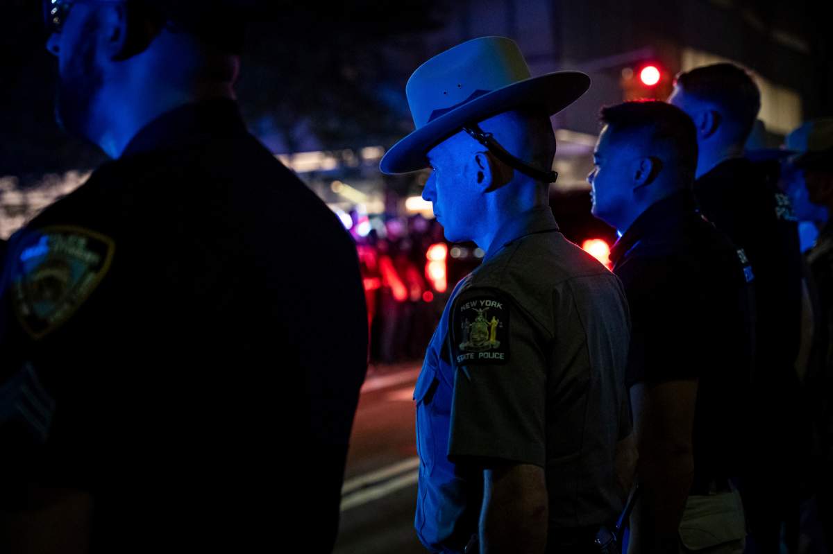 Officers line up during the dignified transfer of Didarul Islam, who was shot and killed by a gunman.