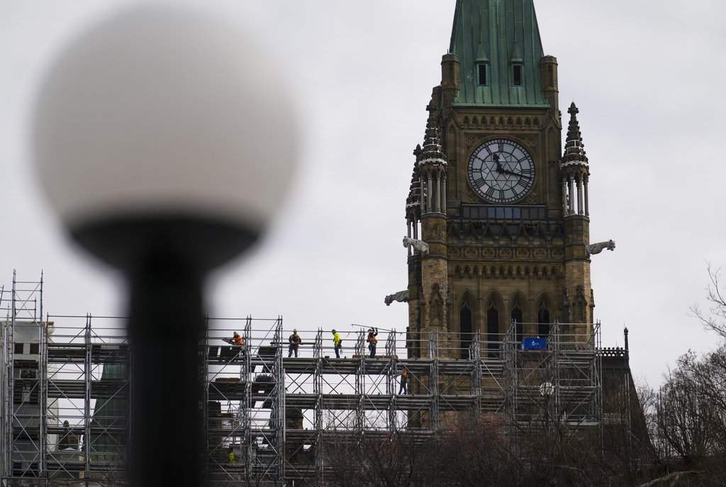 Construction workers build scaffolding on Parliament Hill in Ottawa  on Thursday, March 20, 2025. THE CANADIAN PRESS/Sean Kilpatrick.