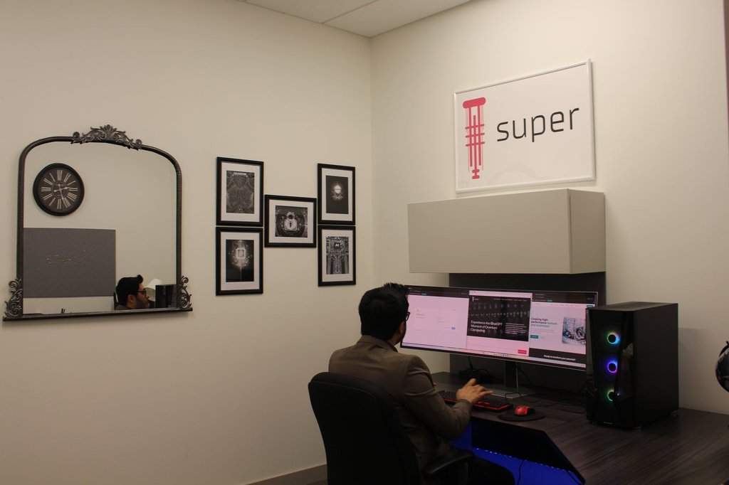 SuperQ Quantum Computing founder Muhammad Khan sits at a computer at the Tecconnect innovation centre at Economic Development Lethbridge, in this handout photo, on Friday, July 18, 2025. 