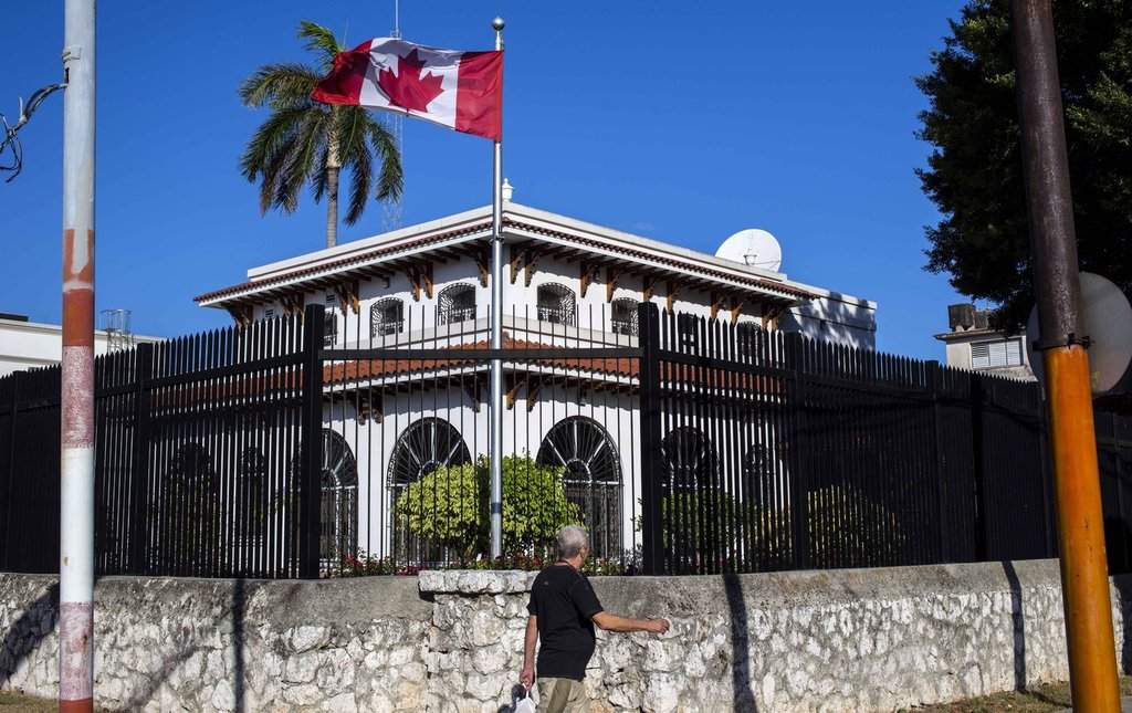 A man walks beside Canada's embassy in Havana, Cuba. 