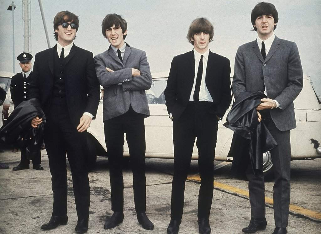 FILE - The Beatles, from left, John Lennon, George Harrison, Ringo Starr and Paul McCartney arrive in Liverpool, England, on July 10, 1964, for the premiere of their movie 'A Hard Day's Night.' (AP Photo, File).