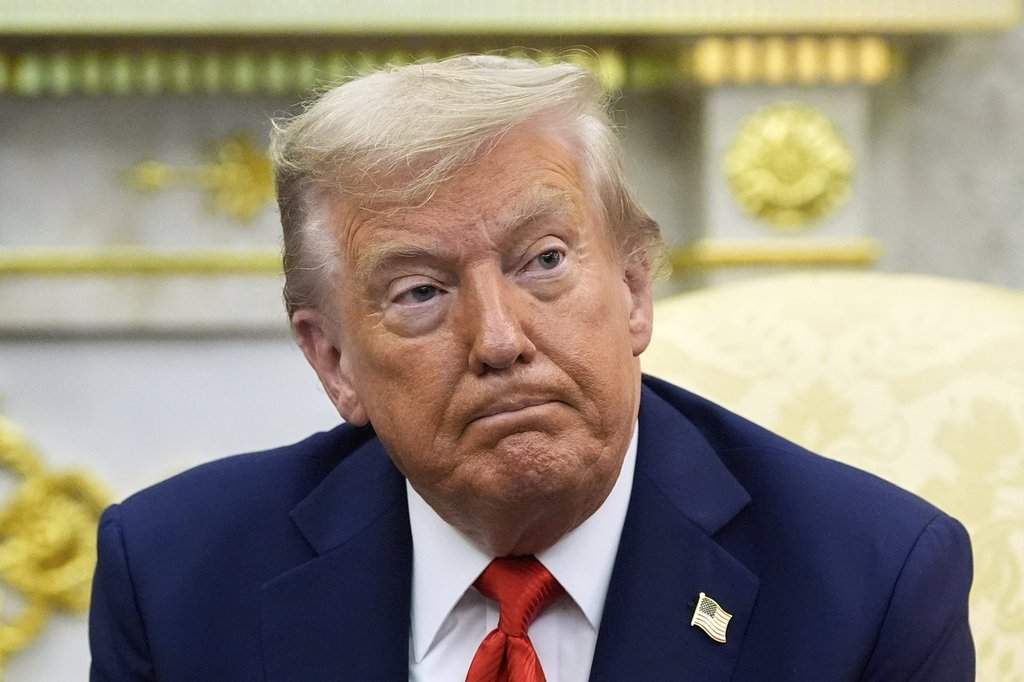 FILE - President Donald Trump listens during a meeting with South Korean President Lee Jae Myung in the Oval Office of the White House, Aug. 25, 2025, in Washington. (AP Photo/Alex Brandon, File).