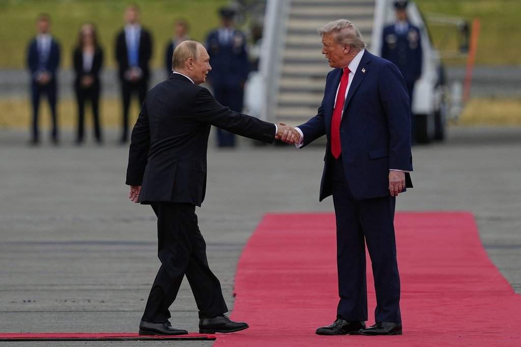 President Donald Trump greets Russia’s President Vladimir Putin Friday, Aug. 15, 2025, at Joint Base Elmendorf-Richardson, Alaska. (AP Photo/Julia Demaree Nikhinson)
