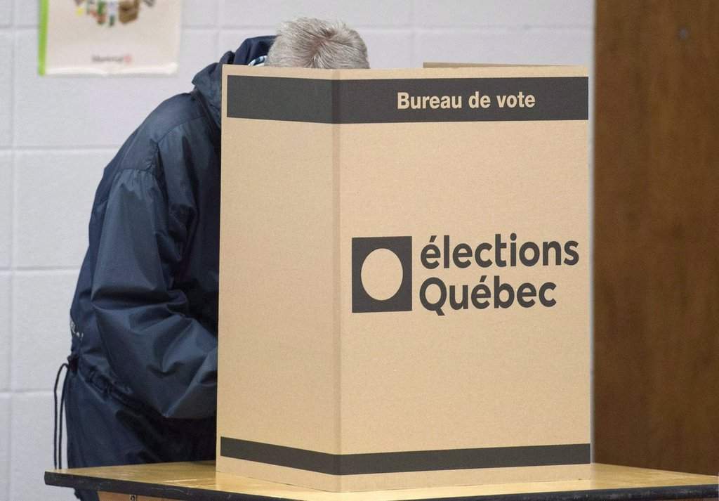 A voter casts a ballot in Montreal, Monday, October 1, 2018, on Quebec provincial election day.