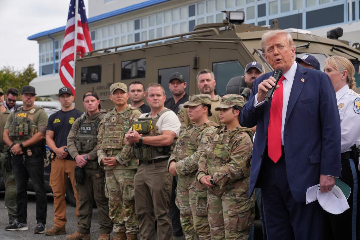 President Donald Trump speaks with members of law enforcement and National Guard soldiers, Thursday, Aug. 21, 2025, in Washington. (AP Photo/Jacquelyn Martin).