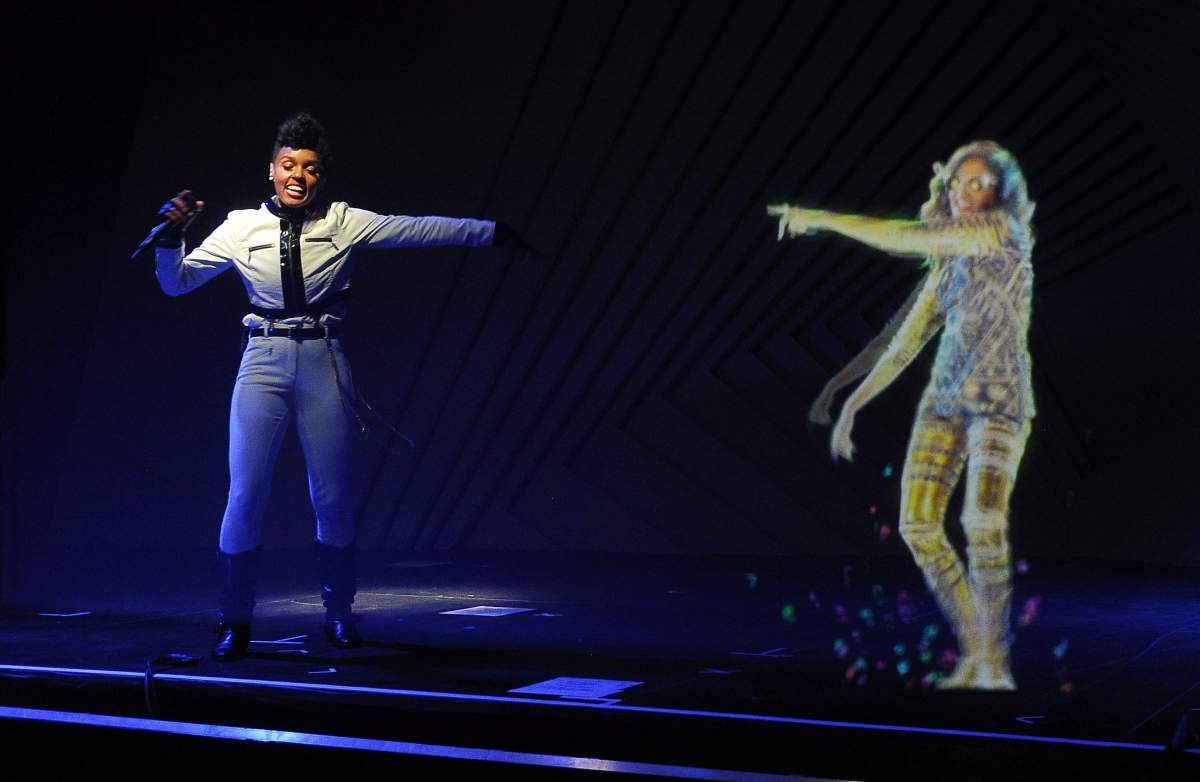 Janelle Monae performs alongside a hologram of M.I.A.
