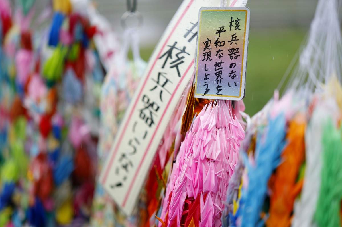 Paper cranes are placed with messages against nuclear weapons in the park marking the hypocenter of the 1945 U.S. atomic bombing of Nagasaki, southwestern Japan, on Aug. 9, 2025, the 80th anniversary of the attack during the Second World War