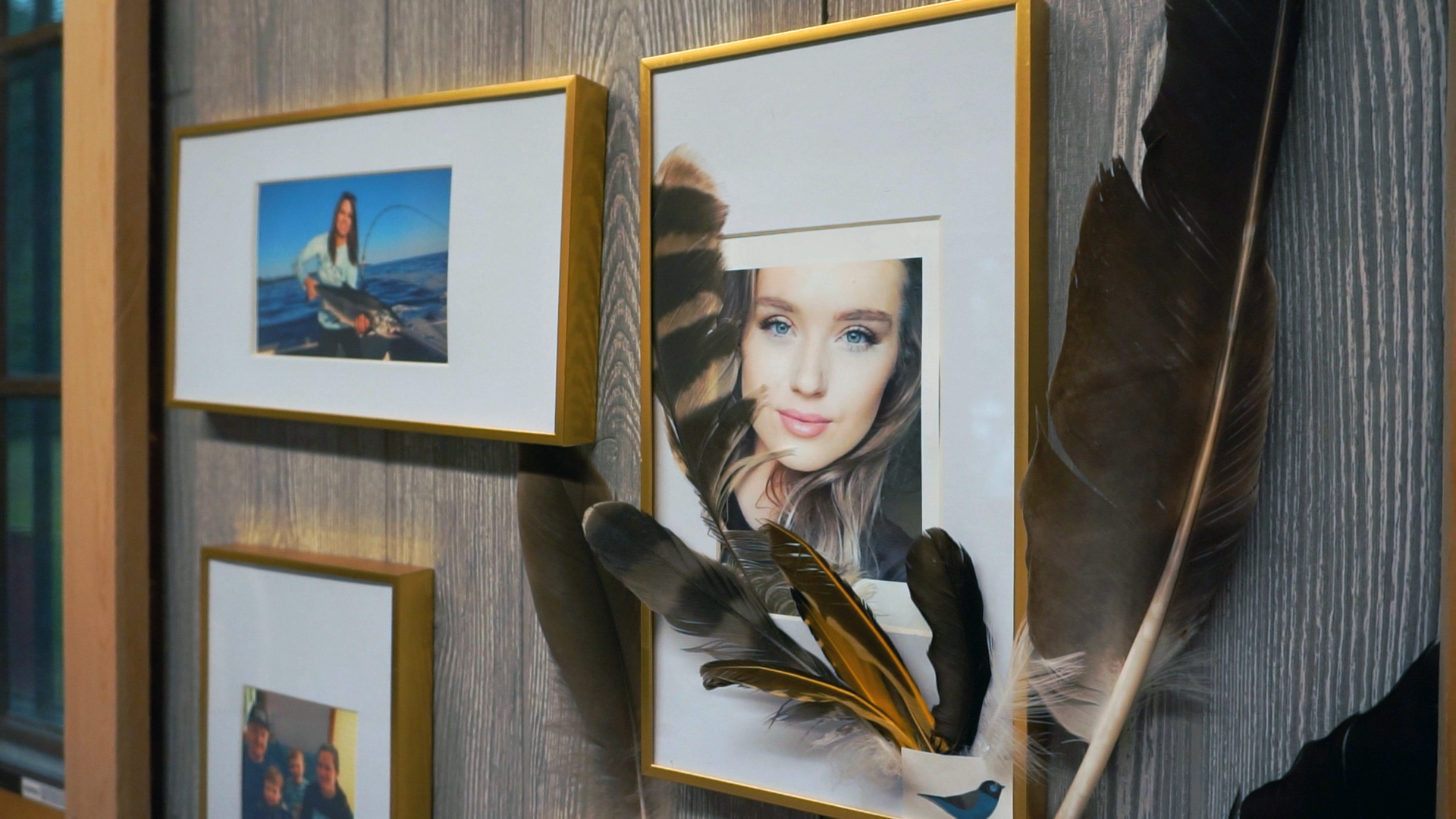 Cally Lester portrait with feathers at Connie's Kenora cabin.