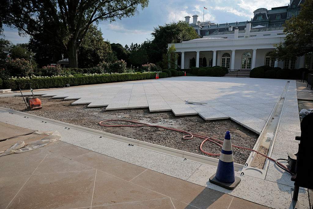 Work continues in paving over the White House Rose Garden lawn on July 23, 2025 in Washington, D.C.