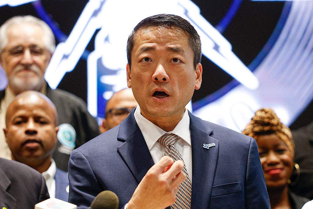 Texas Representative Gene Wu speaks in front of Democratic members of Congress and Texas House Democrats during a news conference, after they left their state to deny Republicans the quorum needed to redraw the state's 38 congressional districts.