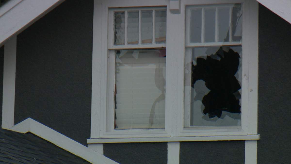 The shattered windows of a home on Crescent Road in Calgary could be seen during a standoff between police and man wanted on a Canada-wide warrant.