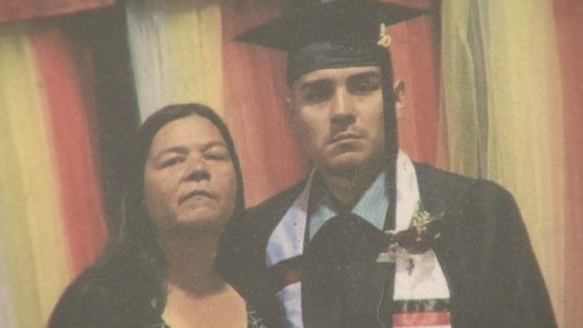 Cheryl Maytwayashing and her son, Lyndon McIvor, on his graduation day.