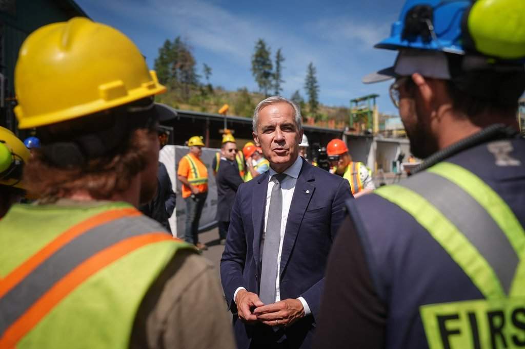 Prime Minister Mark Carney greets employees after touring the Gorman Brothers Lumber sawmill and making an announcement, in West Kelowna, B.C., on Tuesday, August 5, 2025. 