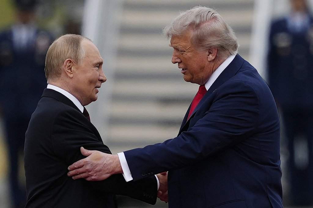 President Donald Trump greets Russia’s President Vladimir Putin Friday, Aug. 15, 2025, at Joint Base Elmendorf-Richardson, Alaska. (AP Photo/Julia Demaree Nikhinson)