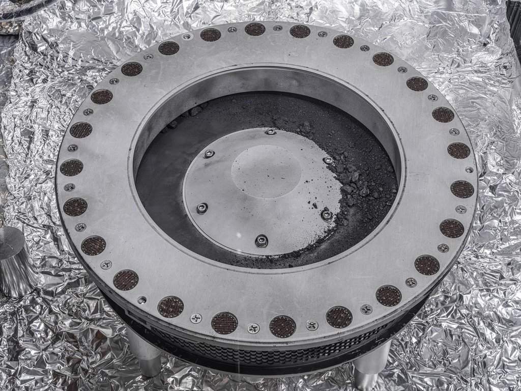 Material from asteroid Bennu can be seen on the middle right, outside the OSIRIS-REx sample container, in this Oct. 11, 2023, handout photo. The bulk of the sample is located inside. THE CANADIAN PRESS/Handout - NASA/Erika Blumenfeld, Joseph Aebersold (Mandatory Credit).