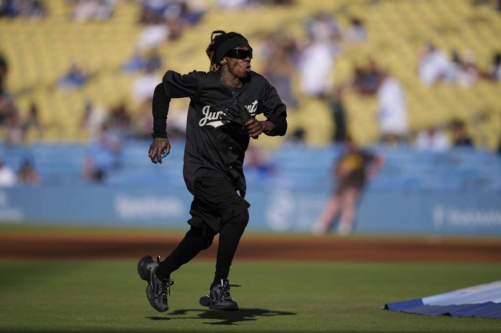 Rapper Lil Wayne plays in a celebrity softball game in Los Angeles, Thursday, June 19, 2025. THE CANADIAN PRESS/AP-Mark J. Terrill.
