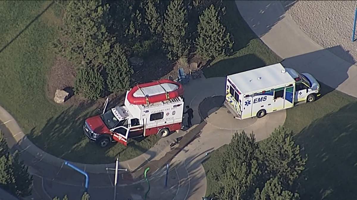 The CFD aquatic rescue team and and ambulance are seen on the shore while rescue crews search Mahogany Lake following reports of a possible drowning on Wednesday evening.