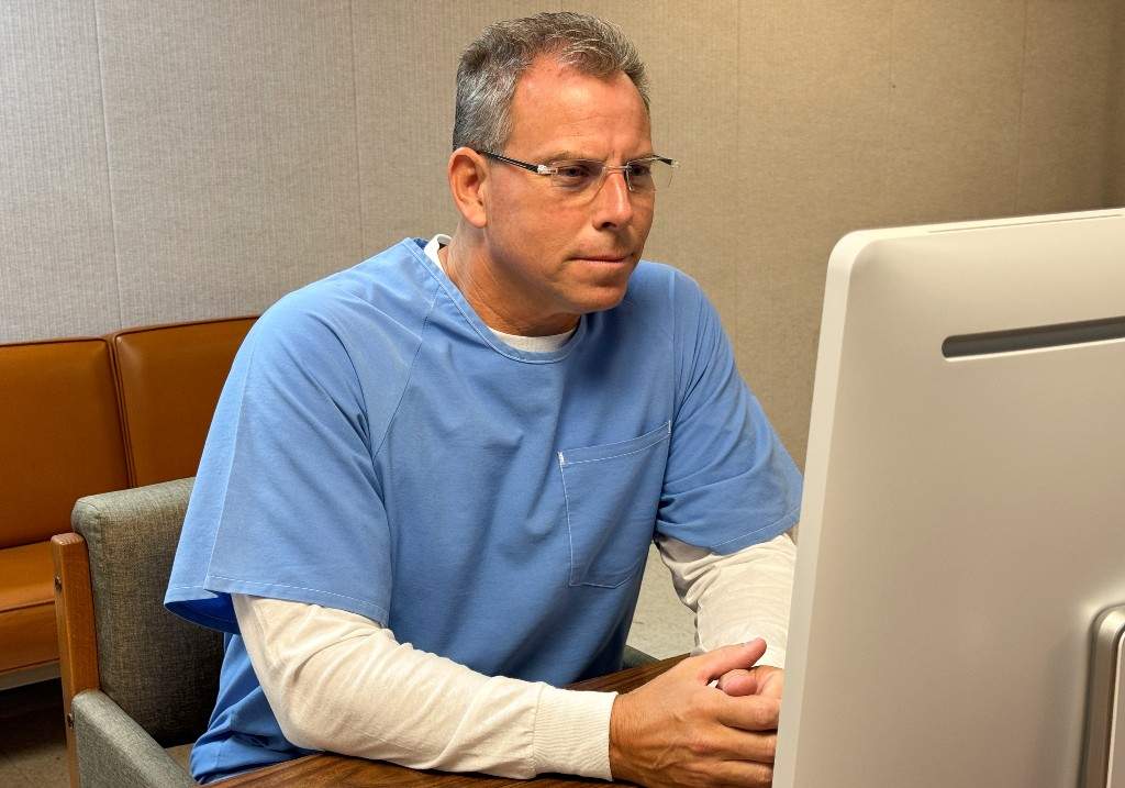 Erik Menendez appears before the parole board via teleconference at the Richard J. Donovan Correctional Facility on August 21, 2025, in San Diego.