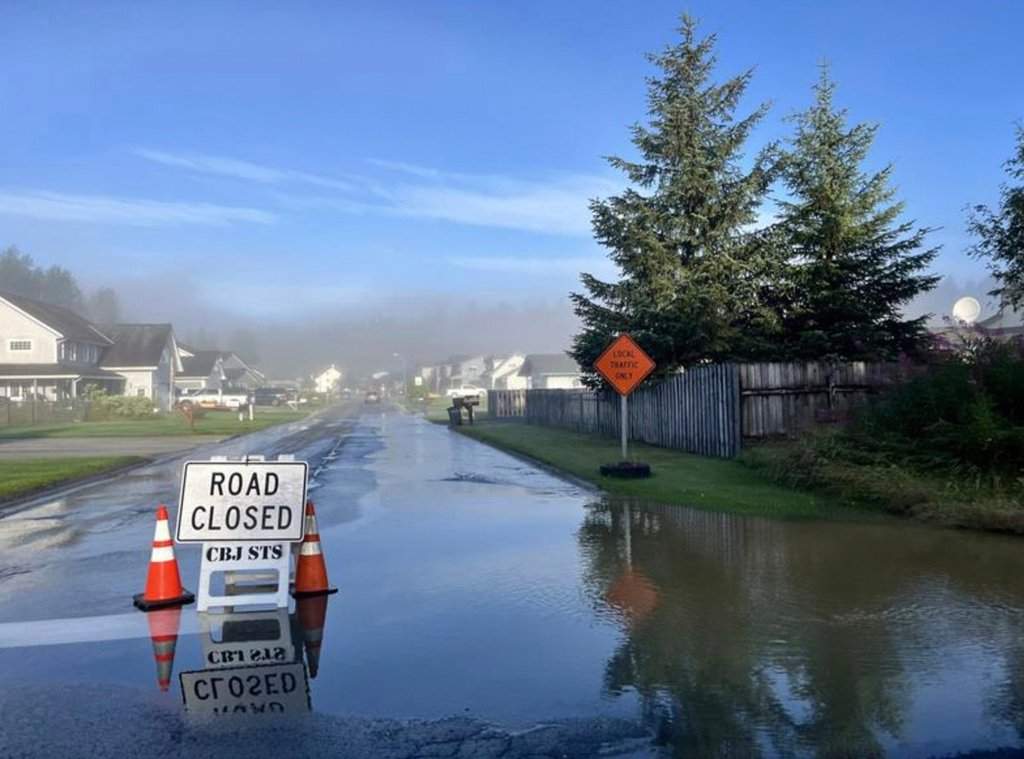This image provided by the City and Borough of Juneau shows flooding from a release of water and snowmelt at Mendenhall Glacier covered some roads and threatened homes along the Mendenhall River in Juneau, Alaska on Wednesday, Aug. 13, 2025. (City and Borough of Juneau via AP).