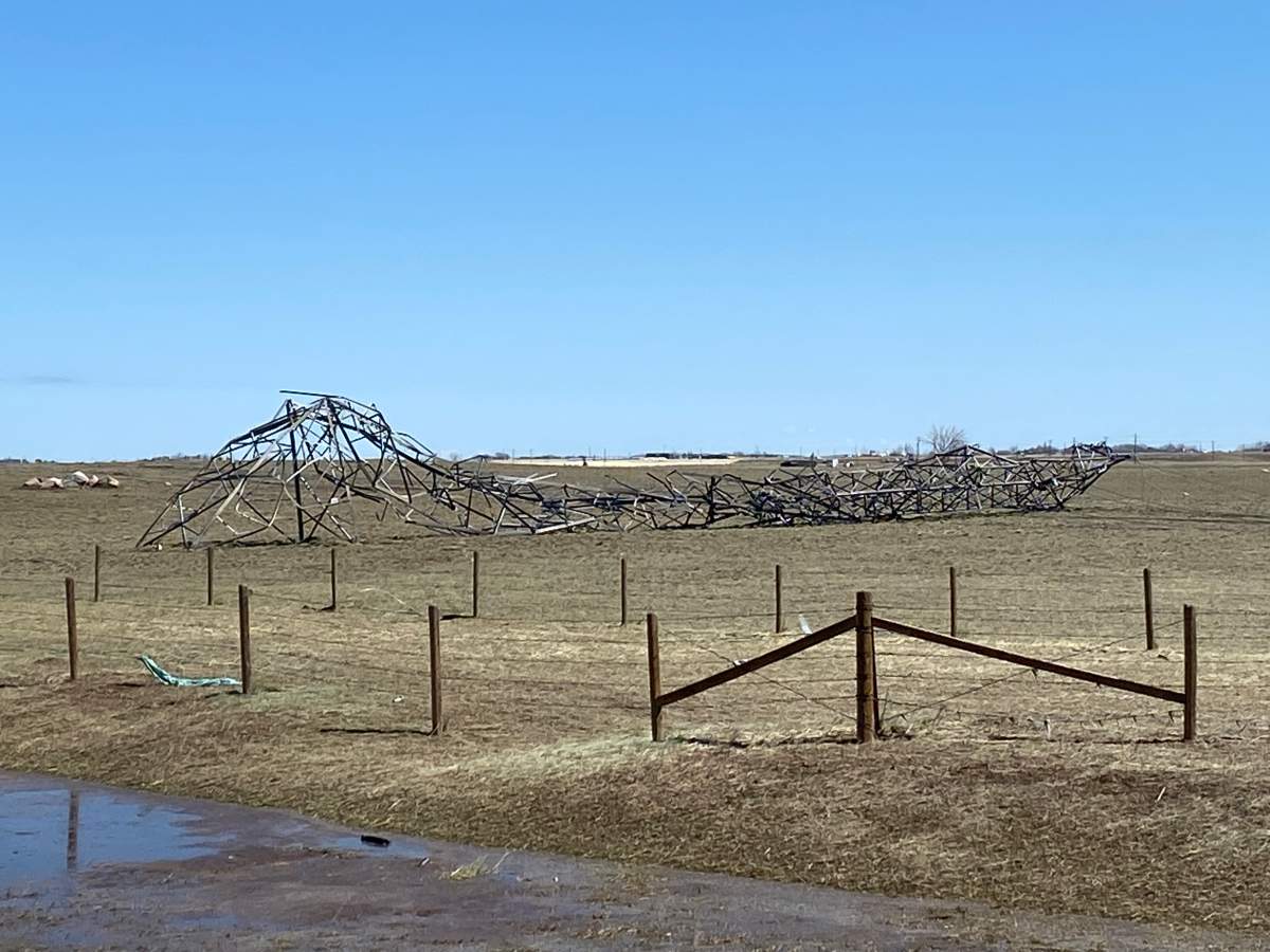 This transmission tower northwest of Brooks was damaged in Wednesday’s storm.