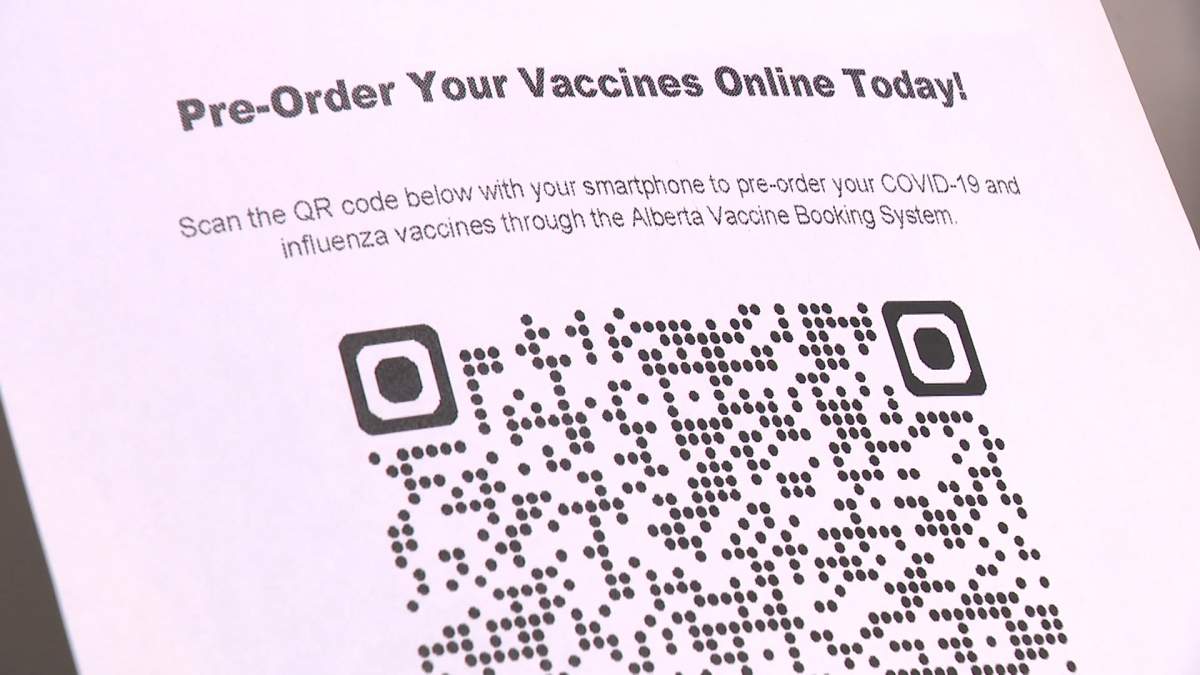 Visitors to a Medicine Shoppe pharmacy in Edmonton are invited to scan a QR code for a link to a website where they can pre-order this year's Covid vaccine.