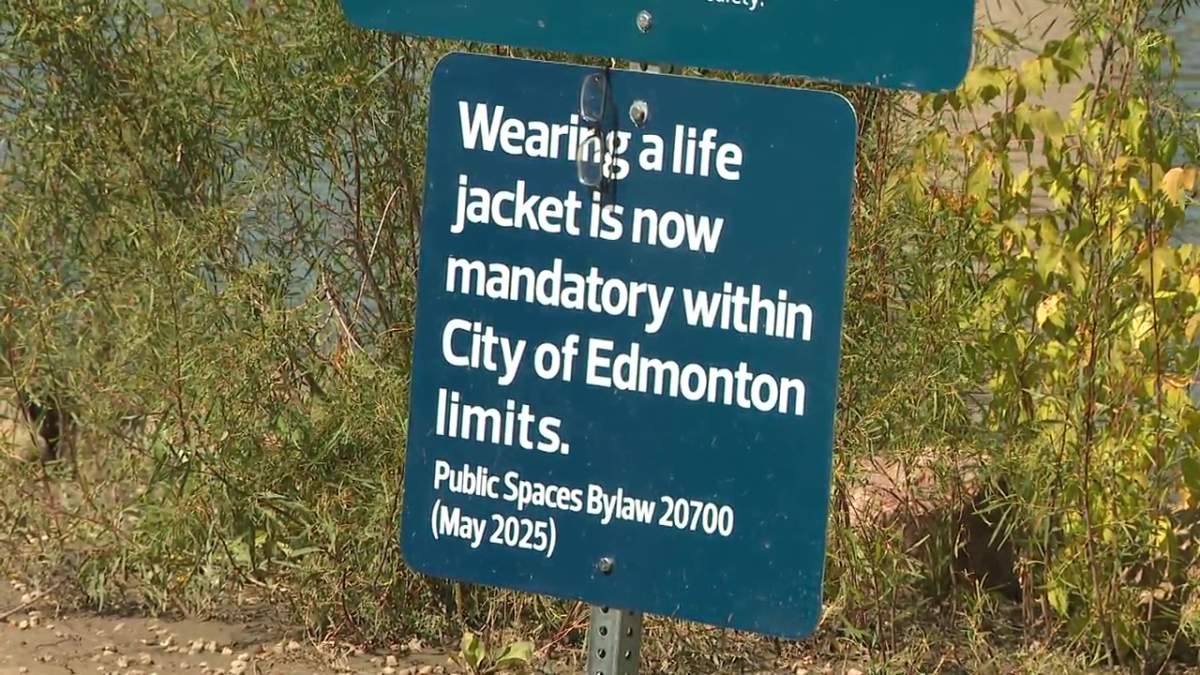 A sign at the Capilano boat launch reminds users of the North Saskatchewan River that life-jackets are now mandatory. Taken on July 31, 2025.
