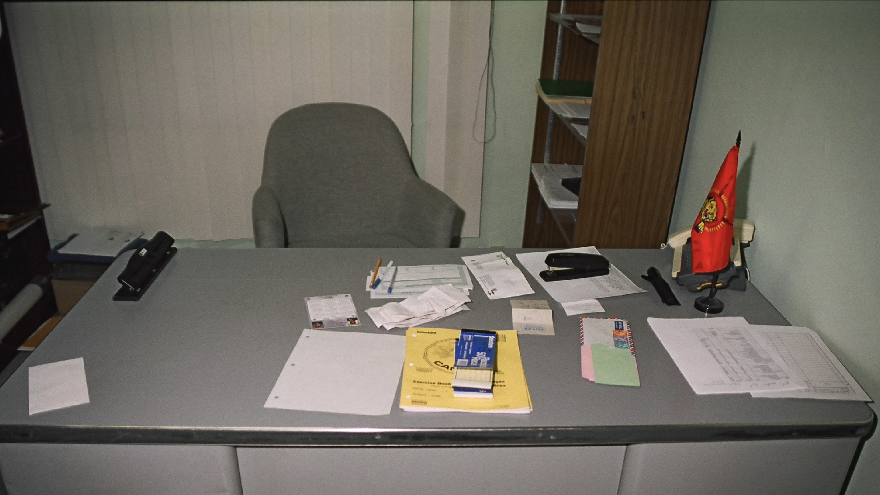 Red Tamil Tigers flag on desk in police photo taken during search of World Tamil Movement office in Quebec.