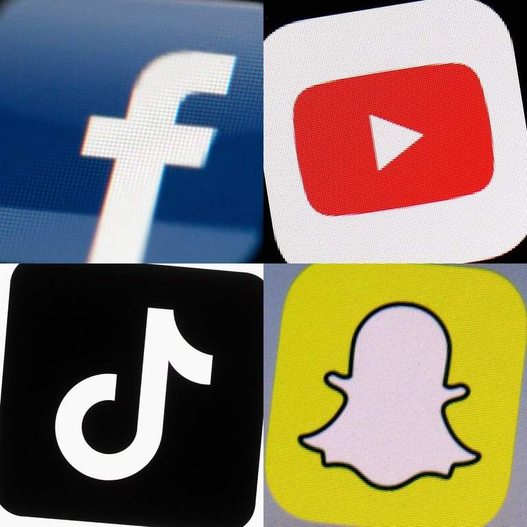 Logos of Facebook, YouTube, TikTok and Snapchat on mobile devices. 