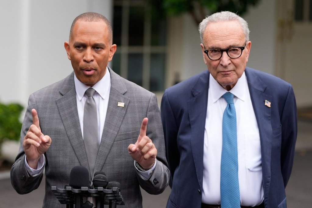 House Minority Leader Hakeem Jeffries, D-N.Y., and Senate Minority Leader Chuck Schumer of N.Y., talk to reporters outside the West Wing of the White House, Monday, Sept. 29, 2025, in Washington. (AP Photo/Alex Brandon).