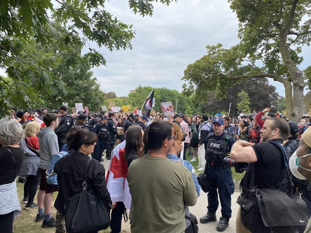 Police and Fire officers separate an anti-immigration protest from a counter-protest in Christie Pits Park, in Toronto, Saturday, Sept. 13, 2025. 
