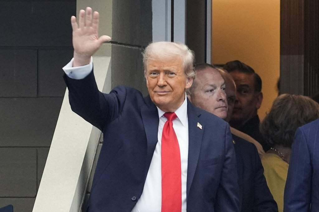 President Donald Trump waves as he arrives at the US Open tennis men's singles final Sunday, Sept. 7, 2025, in Flushing, N.Y.