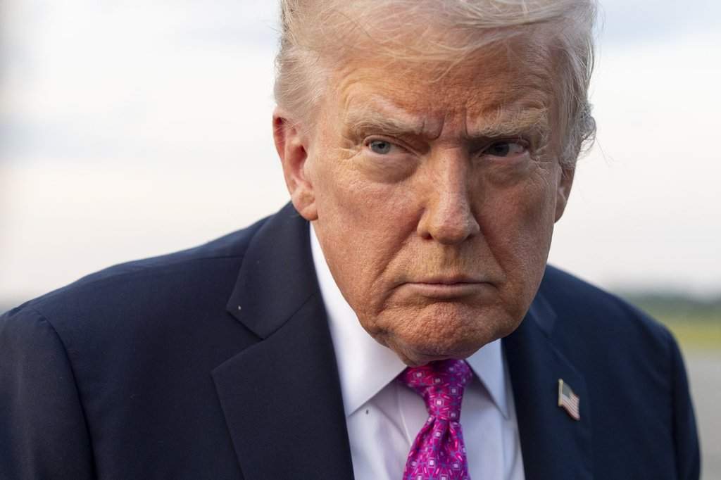 President Donald Trump speaks with reporters before he departs on Air Force One at Morristown Airport, Sunday, Sept. 14, 2025, in Morristown, N.J.