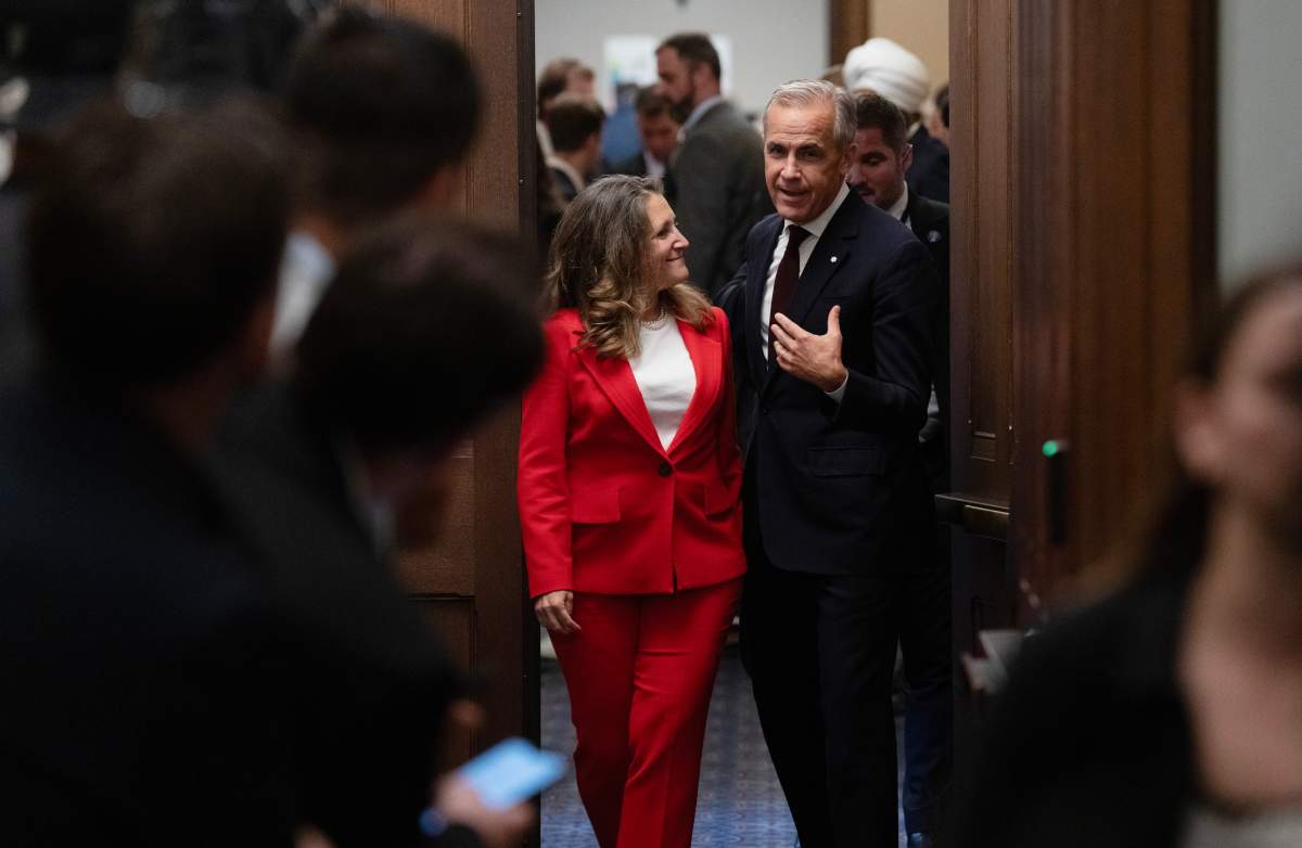 Prime Minister Mark Carney speaks with Minister of Transport and Internal Trade Chrystia Freeland as they leave a cabinet meeting on Parliament Hill in Ottawa, Tuesday, Sept. 16, 2025. THE CANADIAN PRESS/Adrian Wyld