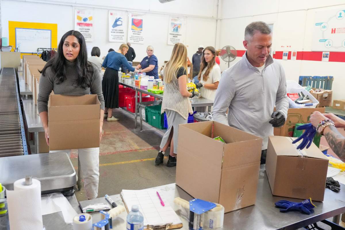 Volunteers work at the Food Banks Canada distribution centre in Toronto, Thursday, Oct. 24, 2024.
