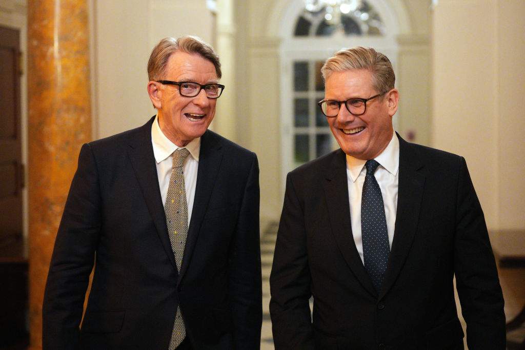 British Prime Minister Keir Starmer (R) talks with Britain's ambassador to the United States Peter Mandelson during a welcome reception at the ambassador's residence on February 26, 2025 in Washington, DC.
