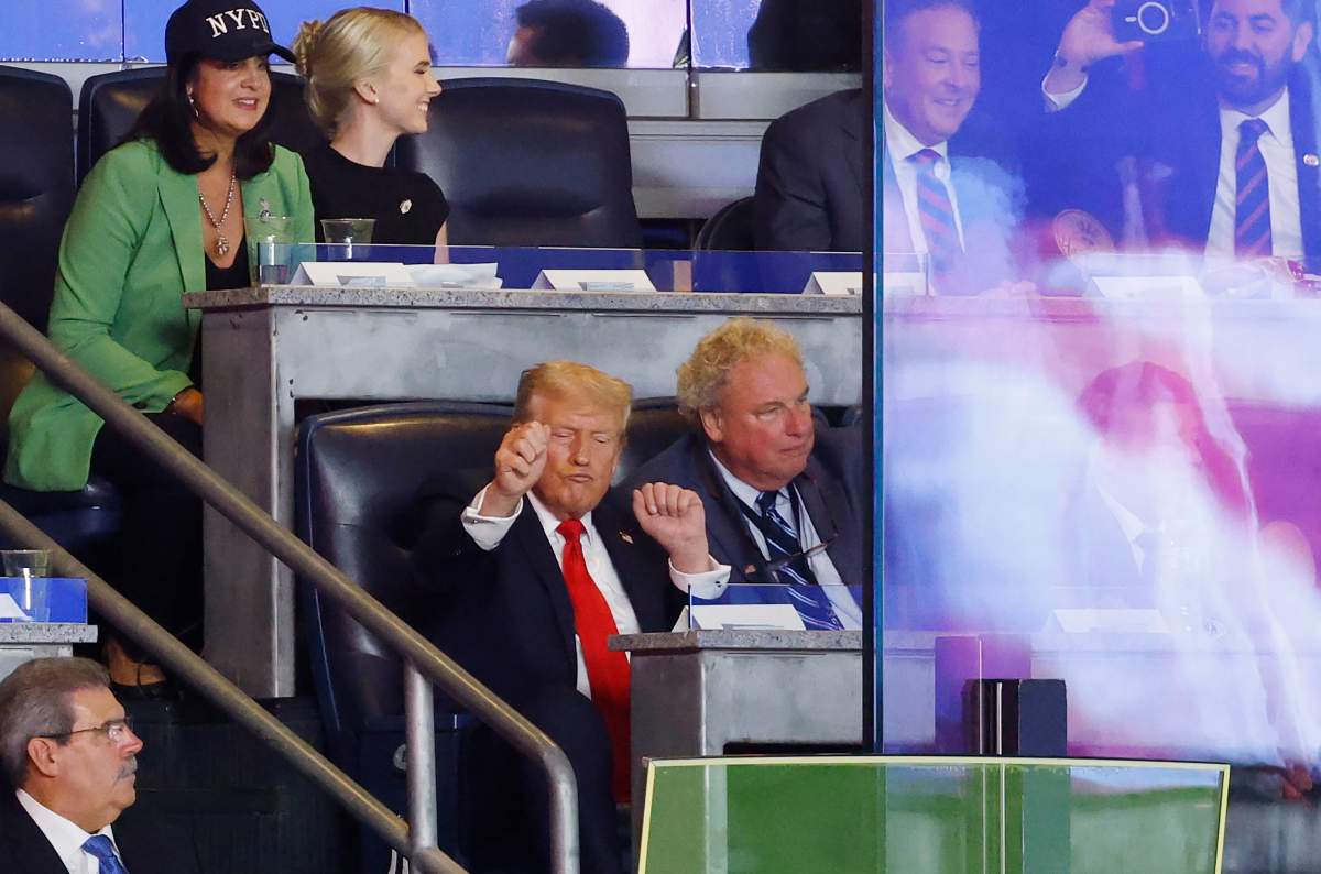 U.S. President Donald Trump moves to the song 'YMCA' at a game between the New York Yankees and Detroit Tigers at Yankees Stadium on September 11, 2025 in New York City.