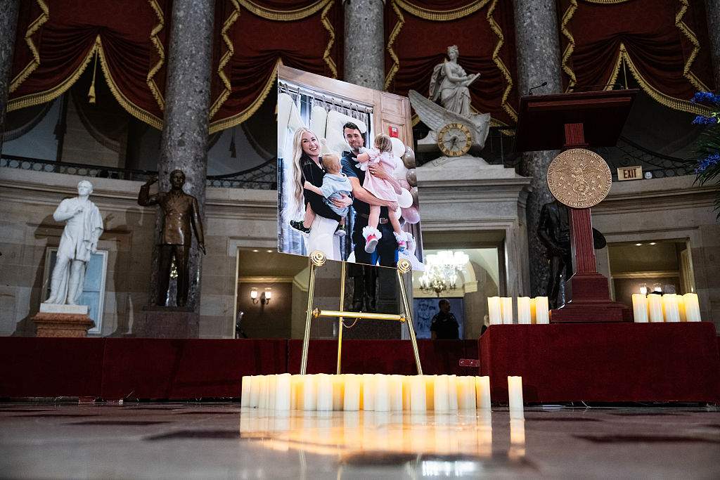 A photo of political media personality Charlie Kirk, his children and wife, Erika, is seen after an all-member memorial service in the U.S. Capitol's Statuary Hall on Monday, September 15, 2025.