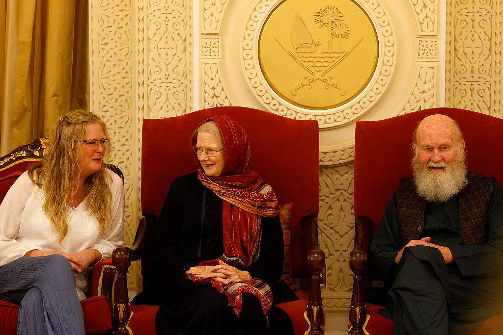 Sarah Entwistle (L) sits with her parents Barbie (C) and Peter Reynolds after landing at the airport in Doha on September 19, 2025. Peter and Barbie Reynolds have been freed in Afghanistan after several months in detention following mediation by Qatar, an official with knowledge of the release told AFP on Friday.