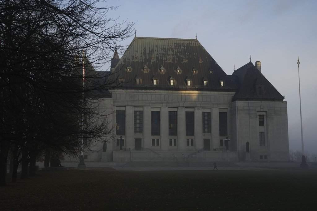 The Supreme Court of Canada building is shrouded in fog in Ottawa, on Friday, Nov. 4, 2022. THE CANADIAN PRESS/Sean Kilpatrick.