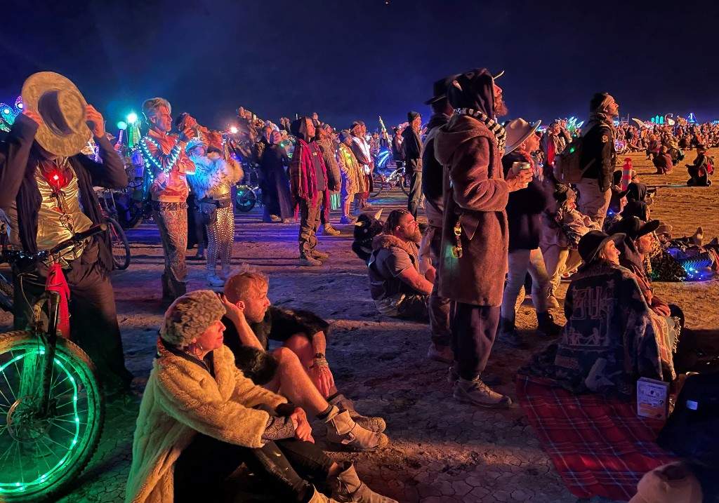 A file photo of attendees gathering to watch the burning of 'The Chapel of Babel,' a work of art by Michael Burlington, during the annual Burning Man Festival in the early morning of September 5, 2023.