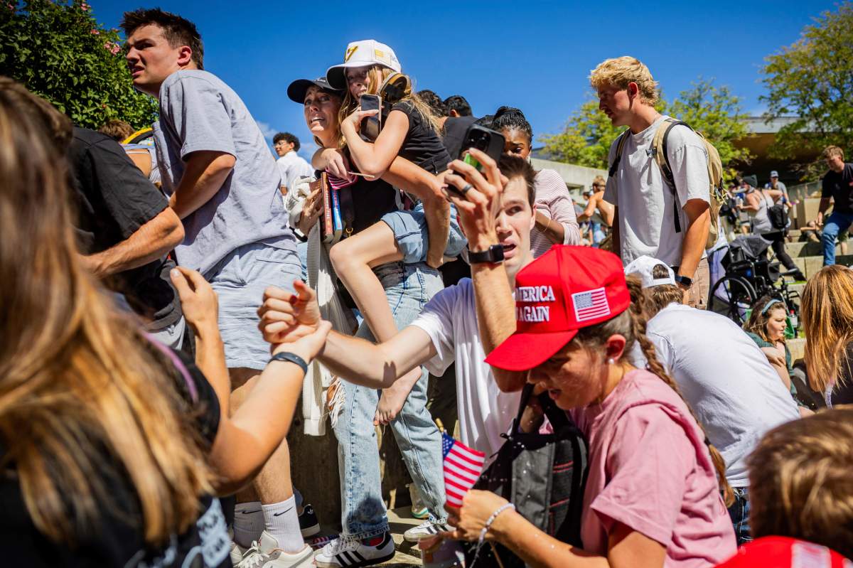 The crowd reacts after Charlie Kirk was shot.