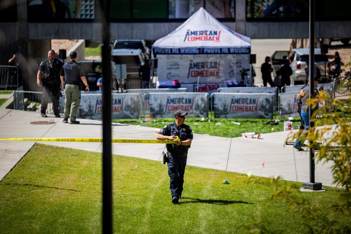 Law enforcement tapes off an area after Charlie Kirk was shot