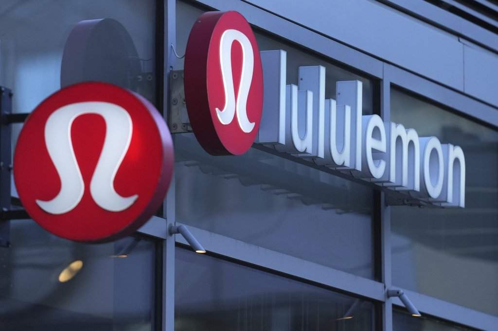 Lululemon signs are displayed outside a retail location in the Seaport District, Dec. 13, 2024, in Boston. (AP Photo/Charles Krupa, File).