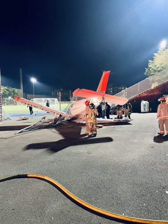 Firefighters are seen responding to a small aircraft that crashed next to the field at Monarch Park Collegiate Institute, in Toronto, in a Monday, Sept. 15, 2025, handout image published by Toronto Fire Chief Jim Jessop to social media site X.