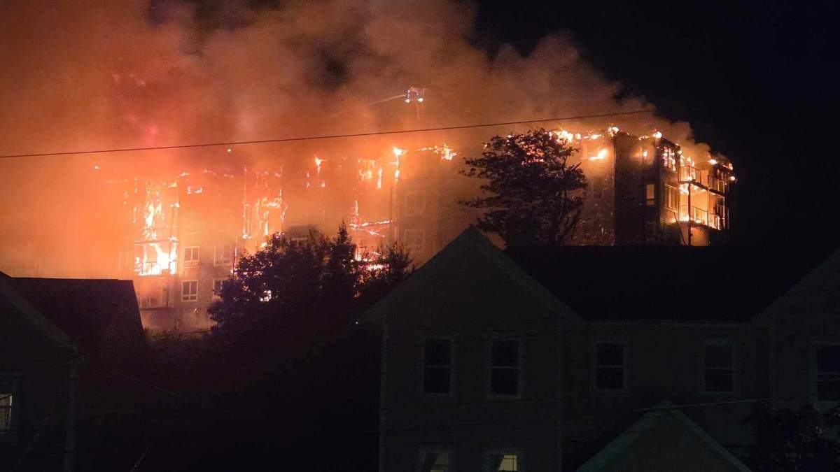 Firefighters work to put out a fire that broke out at an apartment in Sackville, N.S.