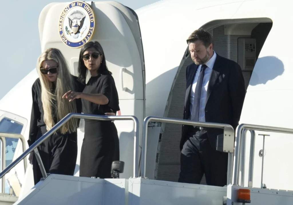 U.S. Vice President JD Vance, right, Second Lady Usha Vance, centre, and Erika Kirk deplane Air Force Two after landing at Phoenix Sky Harbor International Airport, Thursday, Sept. 11, 2025 in Phoenix.