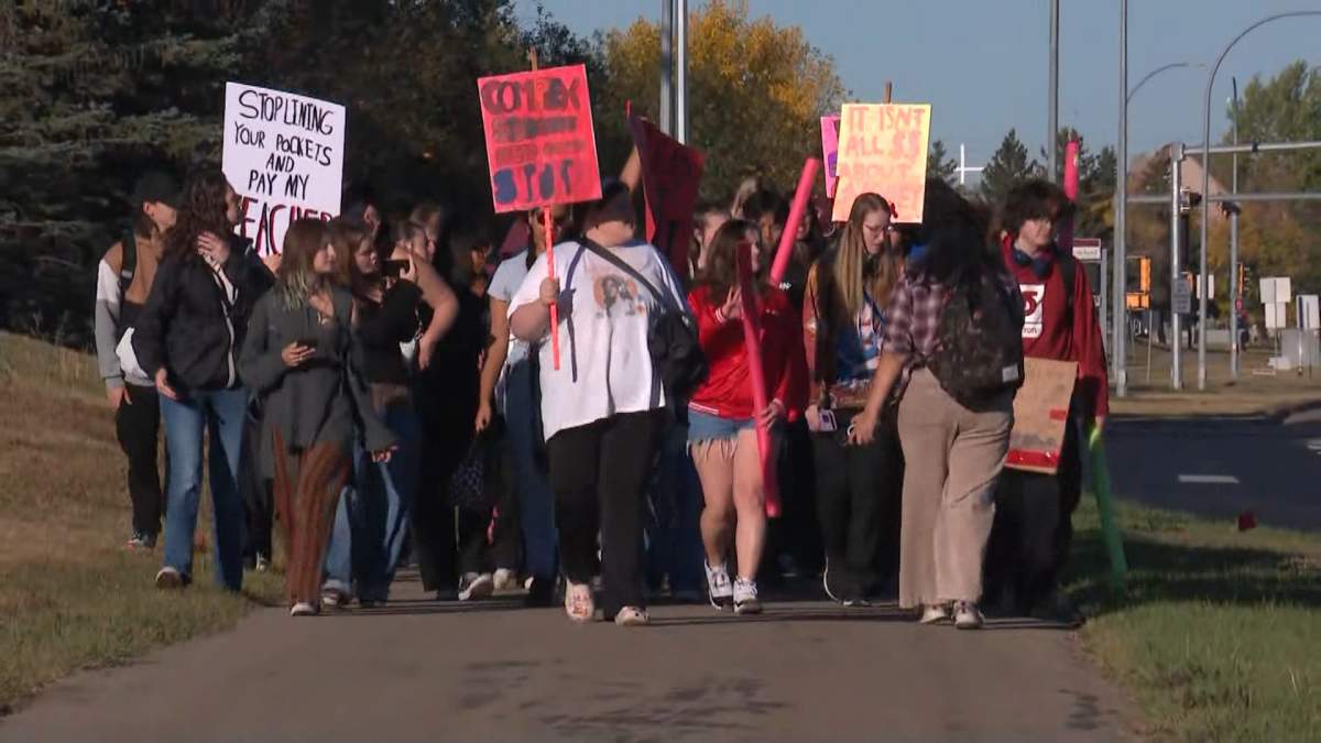 Dozens of students from Holy Trinity school in Edmonton, were among those who rallied Monday in support of teachers contract demands.